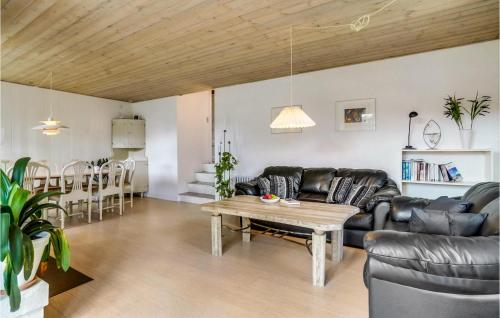 a living room with a couch and a table at Amazing Home In Børkop With Wifi in Børkop