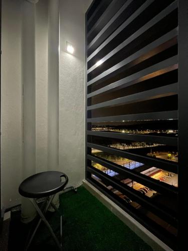 a room with a table and a wine cellar at jugi suite @ Horizon Sepang KLIA in Sepang