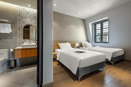 Postel nebo postele na pokoji v ubytování Laputa Hotel Phu Quoc
