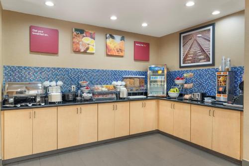 a kitchen with a counter with food on it at Comfort Suites Locust Grove Atlanta South in Locust Grove