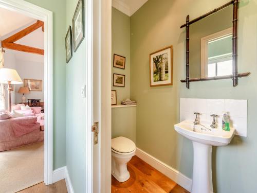 a bathroom with a sink and a toilet at The Fishing Lodge in Amesbury