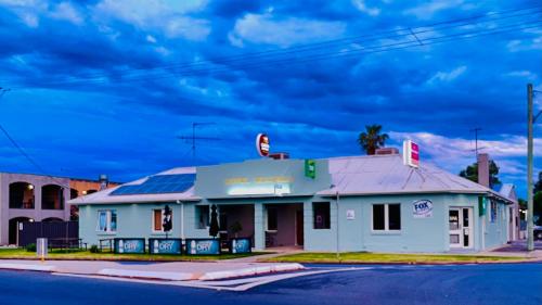 an old gas station on the corner of a street at Lake Mulwala Hotel in Mulwala