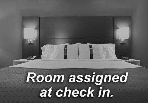 a bedroom with a bed with a room assigned at check in at Holiday Inn Express & Suites Austin North - Pflugerville by IHG in Pflugerville