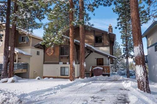 a house in the snow with a driveway at 1228 Timber Lane home in South Lake Tahoe