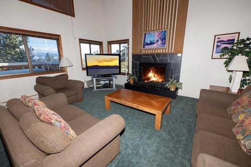 a living room with two couches and a fireplace at 1228 Timber Lane home in South Lake Tahoe