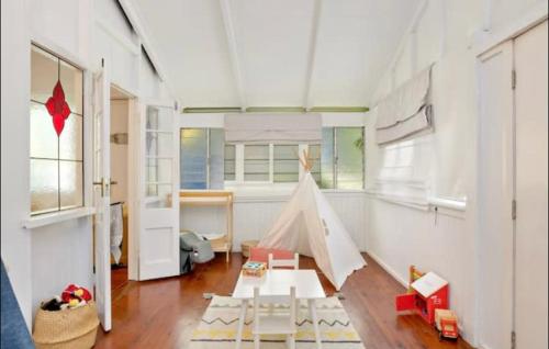 a childs room with a play tent in it at Villa Marshall in Machans Beach