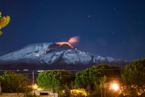 a mountain at night with a fire on it at Donna Carmela - Da Rosa in Letojanni