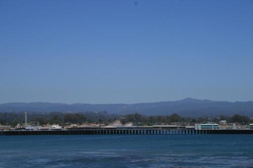 a pier in the middle of a large body of water at Rio Vista Inn & Suites Santa Cruz in Santa Cruz