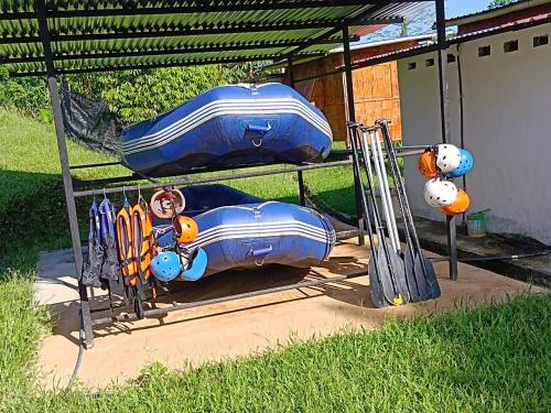 a playground with a toy train and baseball equipment at OYO Home 90737 Disan Baang Kiulu in Ranau