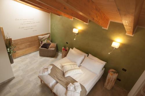 Ένα ή περισσότερα κρεβάτια σε δωμάτιο στο Maison d'hôtes Victoret