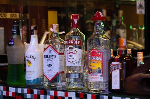 a group of bottles of alcohol on a table at Krabi Freedom Hostel and Bar in Ao Nang Beach