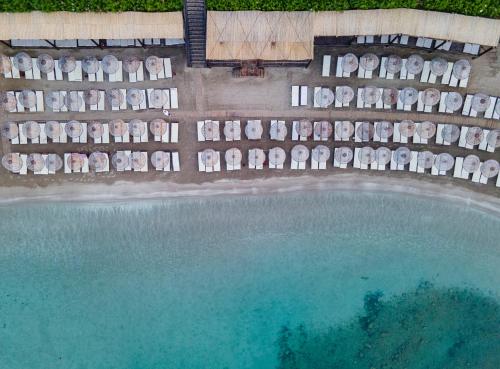 an aerial view of a swimming pool and the beach at LAUR HOTELS Experience & Elegance in Didim