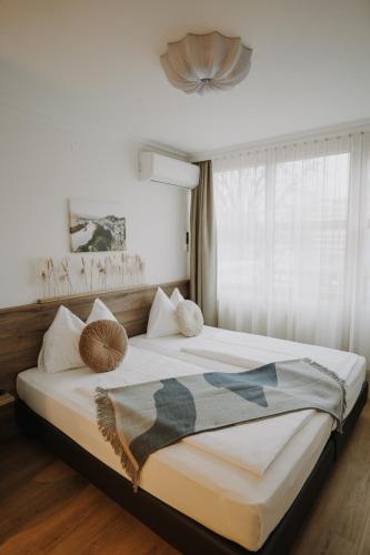 a bedroom with a large bed in a room at Parkhotel Brunauer in Salzburg