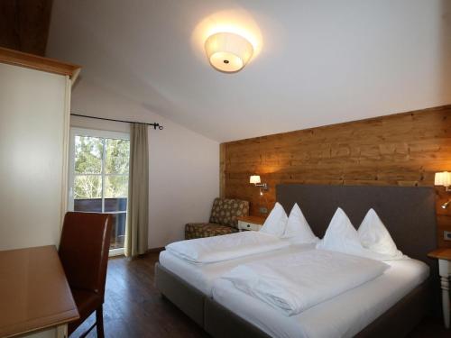 a hotel room with a bed and a window at Holiday house, Flachau in Flachau