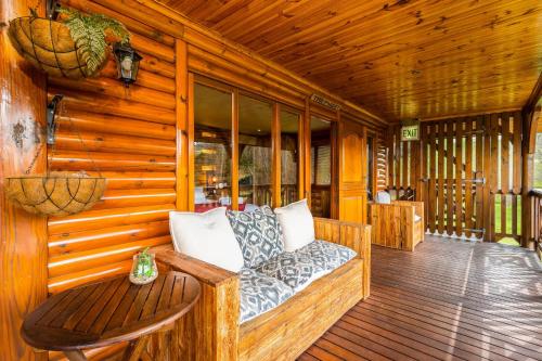 Posezení v ubytování The Log Cabin Lodge