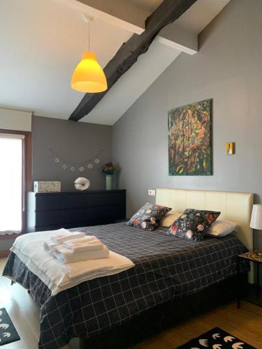 a bedroom with a large bed in a room at Old town cathedral Bilbao in Bilbao