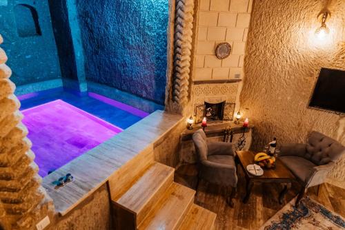 an overhead view of a room with a swimming pool at Bayar Cave Suites in Ürgüp