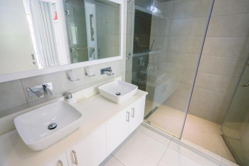 a bathroom with a sink and a shower at The Spot with LOV in Grand Baie