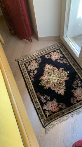 a rug on the floor in front of a door at Ferienhaus, Rustico Auf Burg in Locarno