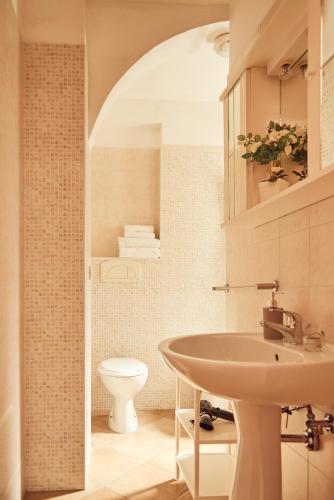 a bathroom with a sink and a toilet at Case Vacanza Torre Canne in Torre Canne
