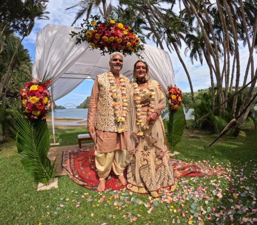 two men posing for a picture under an umbrella at Umtamvuna River Lodge in Port Edward