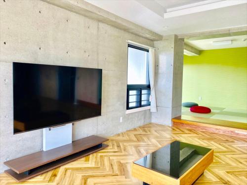 Télévision ou salle de divertissement dans l'établissement CONDOMINIUM 紅-BIN-