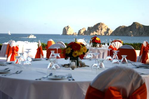 a table set up for a wedding on the beach at Pueblo Bonito Rose Resort & Spa - All Inclusive in Cabo San Lucas