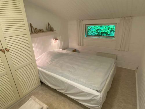 En eller flere senge i et værelse på Summer House Near The Water's Edge On Bornholm