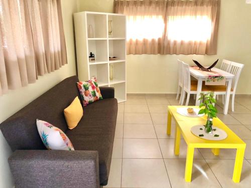 a living room with a couch and a table at Sermilie Beach Houses in Psakoudia