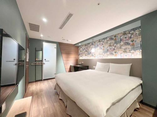 Кровать или кровати в номере 綺樂文旅 開封館 Le Room Hotel Kaifeng