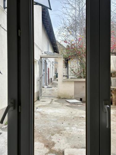 a view from a window of an empty street at Grand logement Centre Ville Massy in Massy