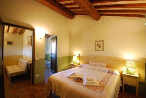 Postel nebo postele na pokoji v ubytování B&B Al Felcino