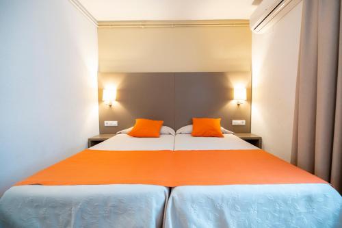 Letto o letti in una camera di Hotel Risech