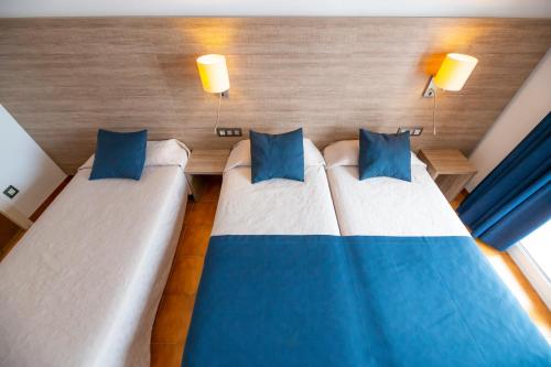 Letto o letti in una camera di Hotel Risech