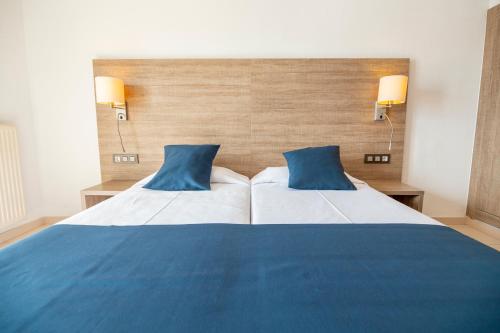 Letto o letti in una camera di Hotel Risech