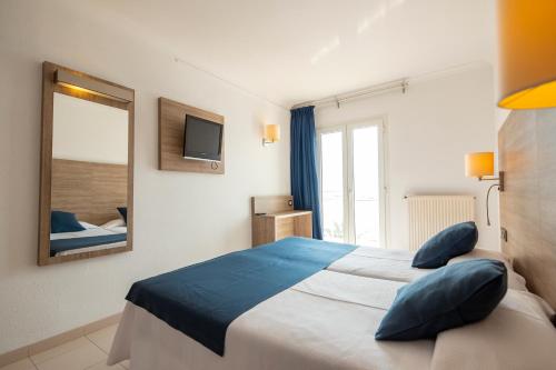 Letto o letti in una camera di Hotel Risech