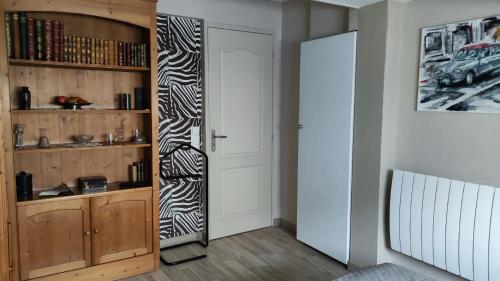 a room with a door with a zebra pattern on it at Nadine & Didier in Le Mans