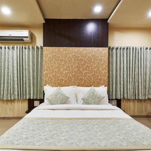 Katil atau katil-katil dalam bilik di Hotel Atria, Kolhapur