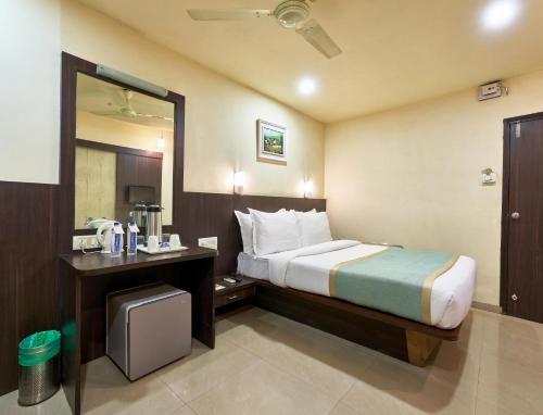 Katil atau katil-katil dalam bilik di Hotel Atria, Kolhapur