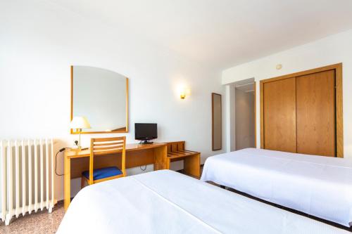 Una cama o camas en una habitación de Hotel Ramblamar