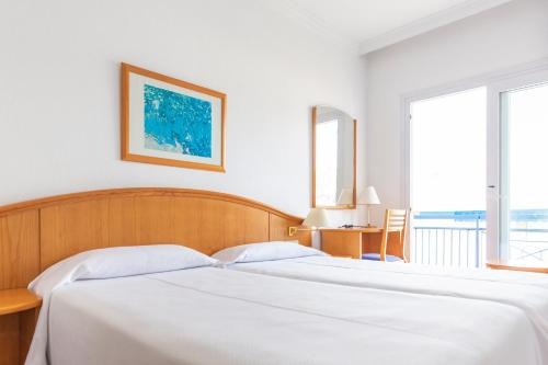 Una cama o camas en una habitación de Hotel Ramblamar
