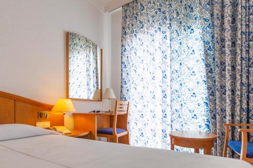 Postel nebo postele na pokoji v ubytování Hotel Ramblamar