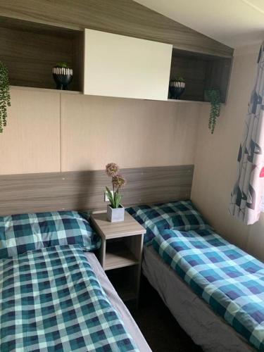 two beds sitting next to each other in a room at Littlesea Haven Rachel's Retreat in Wyke Regis