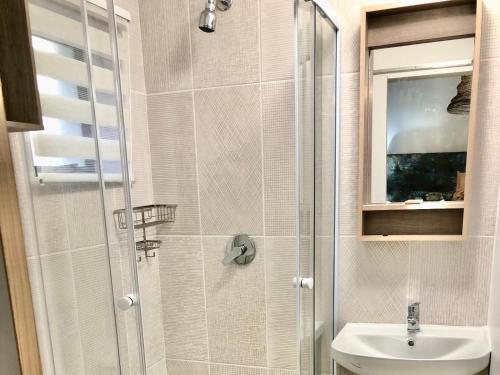 a bathroom with a shower with a toilet and a sink at Paarl Views in Paarl