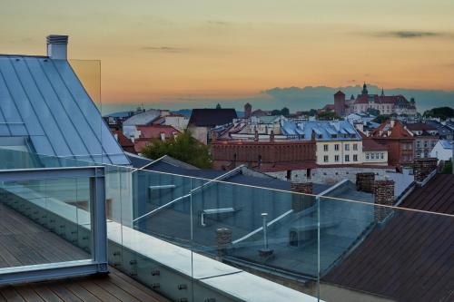 a view of a city from the roof of a building at INX Design Hotel in Kraków