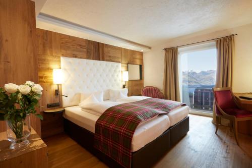 Alpbacherhof Mountain & Spa Resortにあるベッド