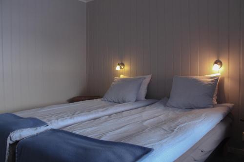 Cama o camas de una habitación en Båtsfjord Brygge - Arctic Resort