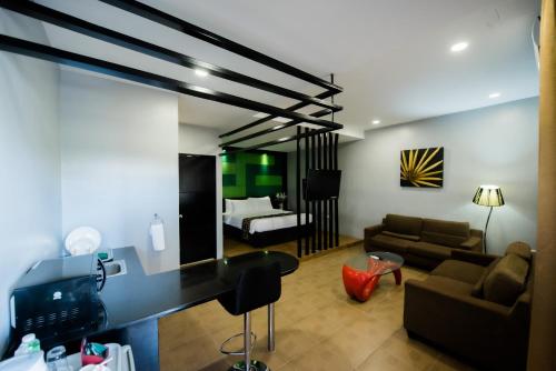 Televízia a/alebo spoločenská miestnosť v ubytovaní SunCity Suites