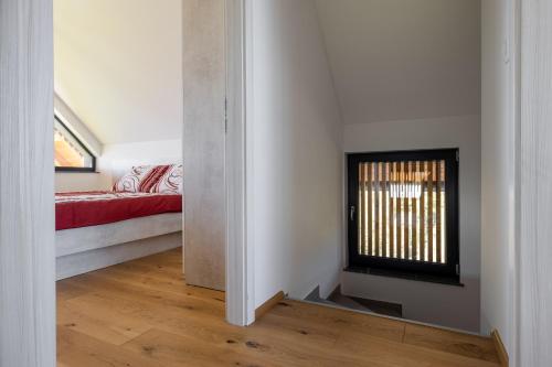 a room with a fireplace and a bed in it at Villa Strtenica in the vineyard in Pristava pri Mestinju