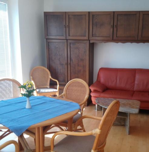 a living room with a table and chairs and a couch at Melker Apartment in Melk